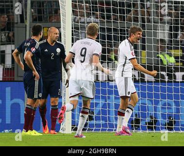 Germany's Thomas Muller celebrates scoring his sides opening goal during the UEFA Euro 2016 Qualifying, Group D match between Germany and Scotland at the Signal Iduna Park, Dortmund on September 7, 2014. Stock Photo