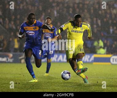 Didier Drogba of Chelsea scores the first goal during the Capital One Cup Fourth Round match between Shrewsbury Town and Chelsea at the Greenhous Meadow Stadium, London on 28, October 2014. Stock Photo