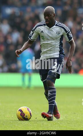 Youssuf Mulumbu of West Bromwich Albion in action during the Barclay's Premier League match between WBA and Newcastle Utd at the Hawthorns Stadium in West Bromwich, United Kingdom on November 9, 2014. Stock Photo