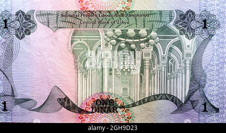 Large fragment of the obverse side of 1 one Libyan dinar banknote currency issued 1984 by the central bank of Libya with interior of mosque image, vin Stock Photo