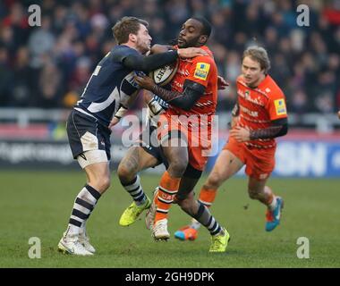 Mark Cueto of Sale Sharks tackles Miles Benjamin of Leicester Tigers during the Aviva Premiership match between Sale Sharks and Leicester Tigers at the AJ Bell Stadium, Salford England on Saturday December 27, 2014. Simon Bellis Stock Photo