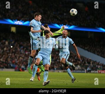 James Milner and Martin Demichelis of Manchester City combine to keep the ball away from Lionel Messi of Barcelona during the UEFA Champions League Round of 16 match between Manchester City and Barcelona at the Etihad Stadium, London on 24th February 2015. Stock Photo