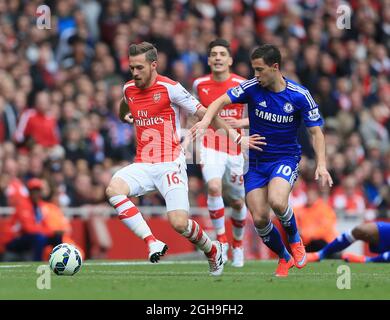 Arsenal's Aaron Ramsey tussles with Chelsea's Eden Hazard during the Barclays Premier League match between Arsenal and Chelsea at Emirates Stadium, England on April 26, 2015. Stock Photo