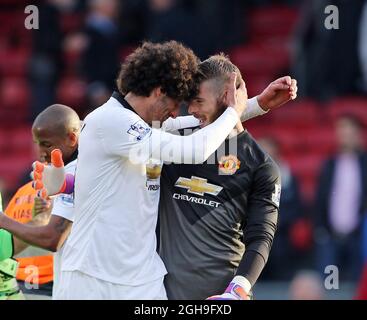 Manchester United's Marouane Fellaini celebrates at the final whistle with David De Gea during the Barclays Premier League match between Crystal Palace and Manchester United at the Selhurst Park in England on May 09, 2015. David Klein Stock Photo