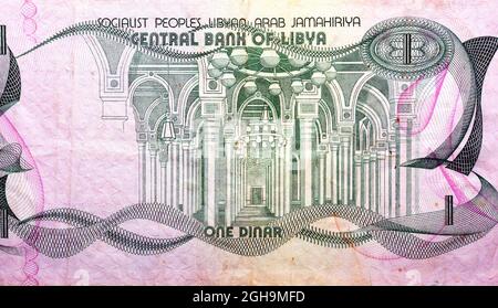 Large fragment of the obverse side of 1 one Libyan dinar banknote currency issued 1981 by the central bank of Libya with interior of mosque image, vin Stock Photo