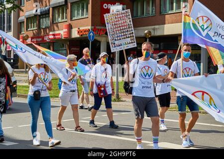 Braunschweig, Germany, August 14, 2021: Employees of the car manufacturer Volkswagen march at the CSD Christopher Street day demonstration. Stock Photo