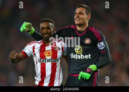 Jermain Defoe and Vito Mannone of Sunderland celebrate during the Barclays Premier League match at the Stadium of Light. Photo credit should read: Philip Oldham/Sportimage via PA Images Stock Photo