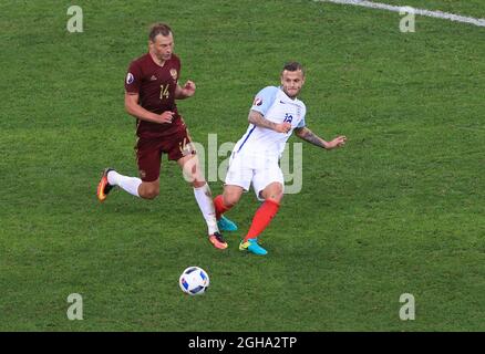 England's Jack Wilshere tussles with Russia's Vasili Berezutski during the UEFA European Championship 2016 match at the Stade Velodrome, Marseille. Picture date June 11th, 2016 Pic David Klein/Sportimage via PA Images Stock Photo