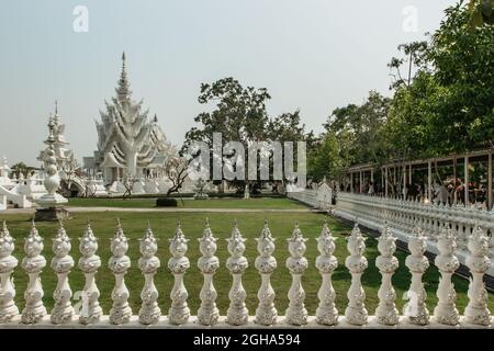 Chiang Rai, Thailand - February 16, 2020. White Temple Wat Rong Khun in North Thailand.Thai Buddhist Temple covered with glass inserts.Asian tourist Stock Photo
