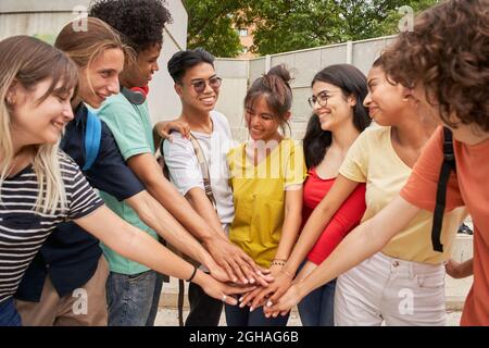 Group of students having a good time together, cheerfully celebrating, happy and motivated. Stock Photo