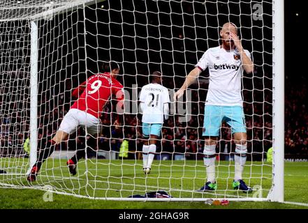 James Collins of West Ham United stands dejected as Zlatan Ibrahimovic of Manchester United turns to celebrate scoring during the Premier League match at the Old Trafford Stadium, Manchester. Picture date: November 27th, 2016. Pic Simon Bellis/Sportimage  via PA Images Stock Photo