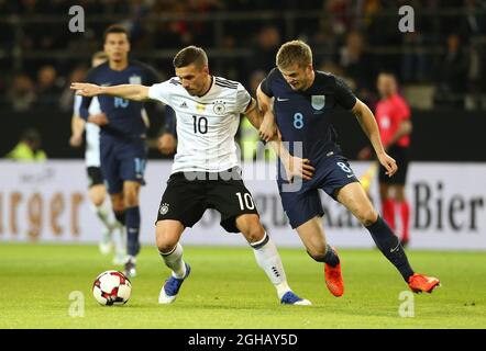 Lukas Podolski of Germany and Eric Dier of England during the International Friendly at Signal Iduna Park, Dortmund. Picture date: March 22nd, 2017. Pic credit should read: Matt McNulty/Sportimage via PA Images Stock Photo