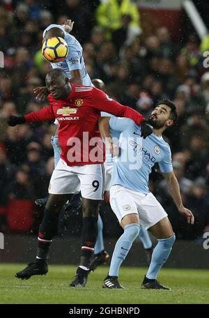 Manchester United's Romelu Lukaku is beaten in the air by Manchester City's Fernandinho and Manchester City's Ilkay Gundogan during the premier league match at Old Trafford Stadium, Manchester. Picture date 10th December 2017. Picture credit should read: Andrew Yates/Sportimage via PA Images Stock Photo