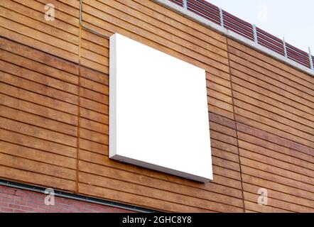 White square billboard on building wall for mockup, poster design presentation Stock Photo
