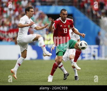 Cedric of Portugal tackles Khalid Boutaib of Morocco during the FIFA World Cup 2018 Group B match at the Luzhniki Stadium, Moscow. Picture date 20th June 2018. Picture credit should read: David Klein/Sportimage Stock Photo