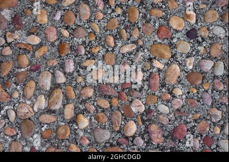 detail of a floor formed with colored pebbles and mortar Stock Photo