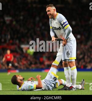 Derby County's Richard Keogh stretches his teammates leg during the Carabao Cup Third Round match at Old Trafford Stadium, Manchester. Picture date 25th September 2018. Picture credit should read: Matt McNulty/Sportimage Stock Photo