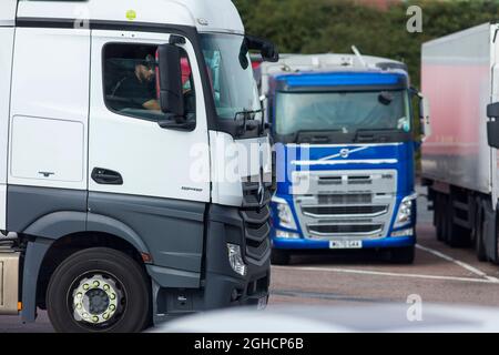 Lorries,trucks, and HGVs on the M1 motorway at Leicester Forest service station. Stock Photo