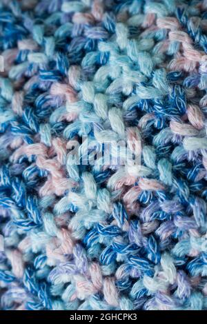 Close up of blue and pink knitted wool texture of a sweater Stock Photo