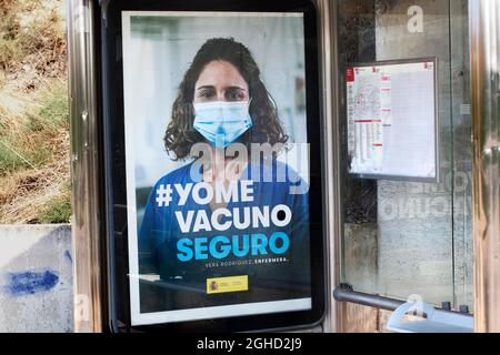 Vaccination campaign poster at bus stop, La Floresta, Catalonia, Spain. Stock Photo