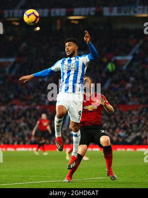 Huddersfield Town's Elias Kachunga and Manchester United's Luke Shaw during the Premier League match at Old Trafford, Manchester. Picture date: 26th December 2018. Picture credit should read: Matt McNulty/Sportimage via PA Images Stock Photo