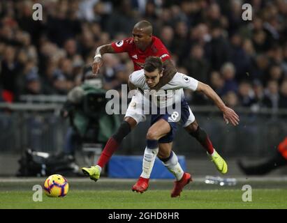 Manchester United's Ashley Young (left) and Tottenham Hotspur's Harry Winks battle for the ball during the Premier League match at Wembley Stadium, London. Picture date: 13th January 2019. Picture credit should read: David Klein/Sportimage Stock Photo