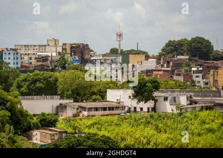 Salvador, Bahia, Brazil - February 21, 2014: View of the poorest part of the city with houses built in the dangerous mountains. Stock Photo