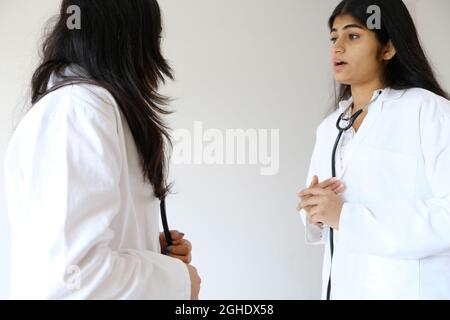 Female South Asian doctors from India talking to each other Stock Photo