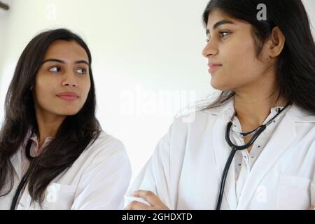 Female South Asian doctors from India talking to each other Stock Photo