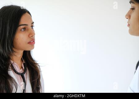Female South Asian doctors from India talking to each other Stock Photo