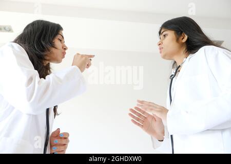 Female South Asian doctors from India talking to each other Stock Photo