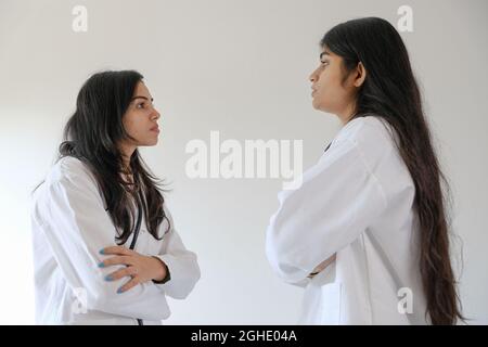 Female South Asian doctors from India talking to each other Stock Photo