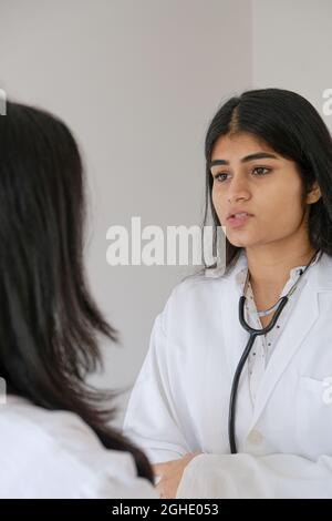 Female South Asian doctors from India talking to each other Stock Photo