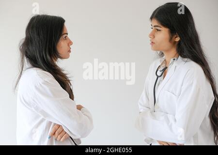 Female South Asian doctors from India talking to each other Stock Photo
