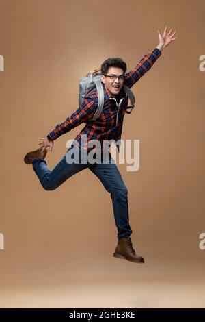 Cheerful young man jumping Stock Photo
