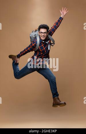 Cheerful young man jumping Stock Photo
