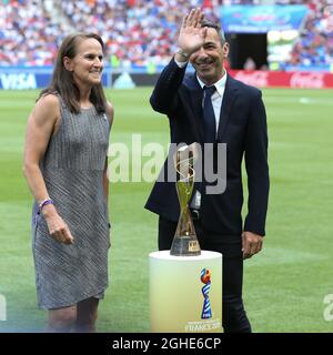 Carla Overbeck ( Actual assistant manager of Duke University and former USA player and Winner of the first ever Women's World Cup in 1991 ) presents the Women's FIFA World Cup with Youri Djorkaeff ( Former French National team player and Winner of the FIFA World Cup in 1998 ) during the FIFA Women's World Cup match at Stade de Lyon, Lyon. Picture date: 7th July 2019. Picture credit should read: Jonathan Moscrop/Sportimage via PA Images Stock Photo