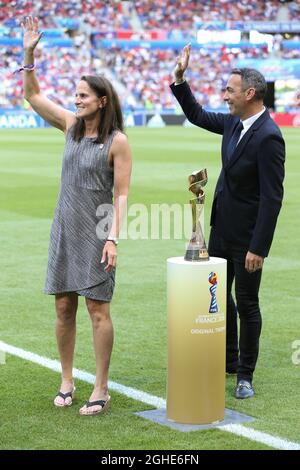 Carla Overbeck ( Actual assistant manager of Duke University and former USA player and Winner of the first ever Women's World Cup in 1991 ) presents the Women's FIFA World Cup with Youri Djorkaeff ( Former French National team player and Winner of the FIFA World Cup in 1998 ) during the FIFA Women's World Cup match at Stade de Lyon, Lyon. Picture date: 7th July 2019. Picture credit should read: Jonathan Moscrop/Sportimage via PA Images Stock Photo