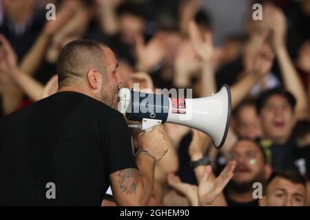 AN AC Milan Ultra use a megaphone to encourage fans to sing during