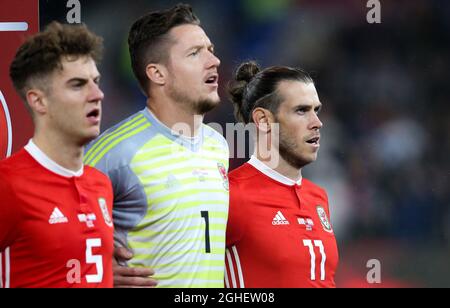 Gareth Bale (r) sings the national anthem of Wales during the UEFA Euro 2020 Qualifying match at the Cardiff City Stadium, Cardiff. Picture date: 13th October 2019. Picture credit should read: James Wilson/Sportimage via PA Images Stock Photo