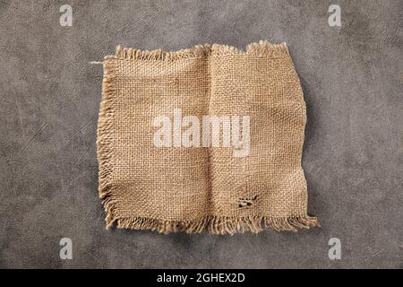 Brown torn piece of burlap jute fabric Stock Photo