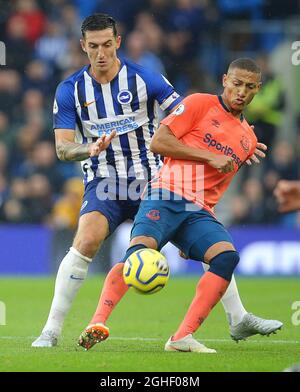 BrightonÕs Lewis Dunk and EvertonÕs Richarlison challenge for the ball during the Premier League match at the American Express Community Stadium, Brighton and Hove. Picture date: 26th October 2019. Picture credit should read: Paul Terry/Sportimage via PA Images