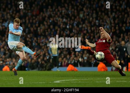 Kevin De Bruyne of Manchester City has his shot blocked by James Milner of Liverpool - Manchester City v Liverpool, UEFA Champions League, Quarter Final, Second Leg, City of Manchester Stadium, Manchester - 10th April 2018. Stock Photo
