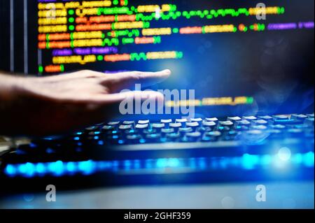 Computer of a programmer with lines code of software Stock Photo