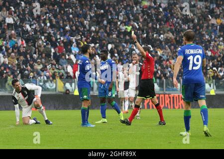 Francesco Magnanelli of Sassuolo is shown a yellow card by referee Federico La Penna during the Serie A match at Allianz Stadium, Turin. Picture date: 1st December 2019. Picture credit should read: Jonathan Moscrop/Sportimage via PA Images Stock Photo