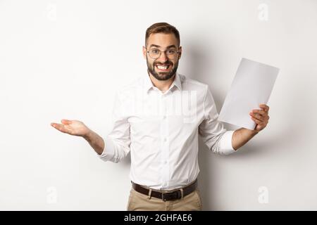Awkward manager showing document and shrugging, looking guilty of ...