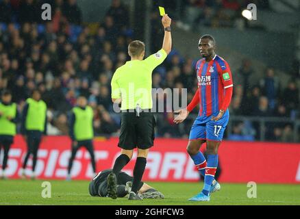 Crystal PalaceÕs Christian Benteke is shown a yellow card for a challenge on BrightonÕs Lewis Dunk during the Premier League match at Selhurst Park, London. Picture date: 16th December 2019. Picture credit should read: Paul Terry/Sportimage via PA Images