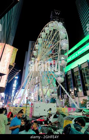 Times Square Wheel, a 110-foot-tall amusement, is a temporary tourist attraction scheduled to shut down September 13. Stock Photo