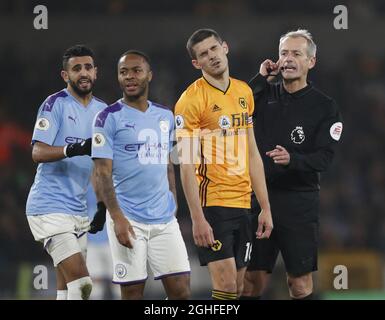 Conor Coady of Wolverhampton Wanderers reacts as referee Martin Atkinson orders the penalty to be retaken  during the Premier League match at Molineux, Wolverhampton. Picture date: 27th December 2019. Picture credit should read: Darren Staples/Sportimage via PA Images Stock Photo