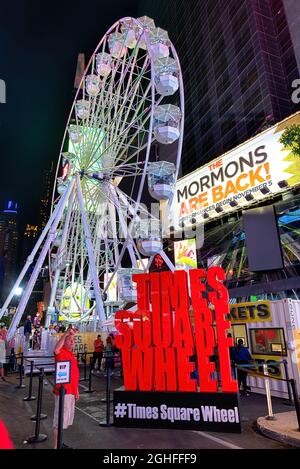 Times Square Wheel, a 110-foot-tall amusement, is a temporary tourist attraction scheduled to shut down September 13. Stock Photo